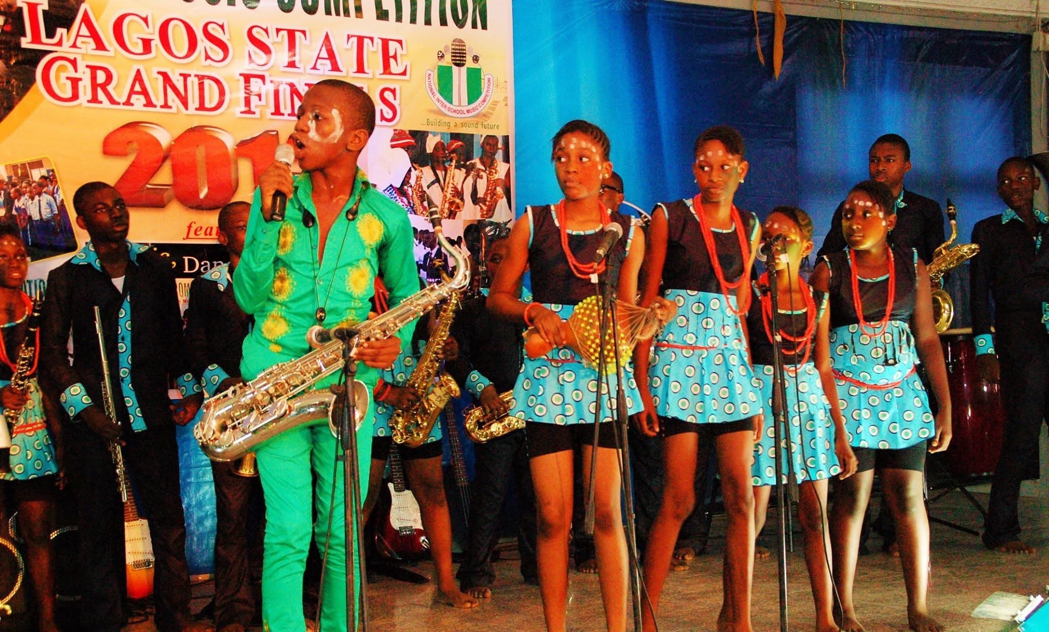 Student saxophonist and school ensemble performing